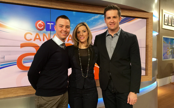 Jordan standing with Canada AM anchor Marcia MacMillan and stamp designer Andrew Perro.